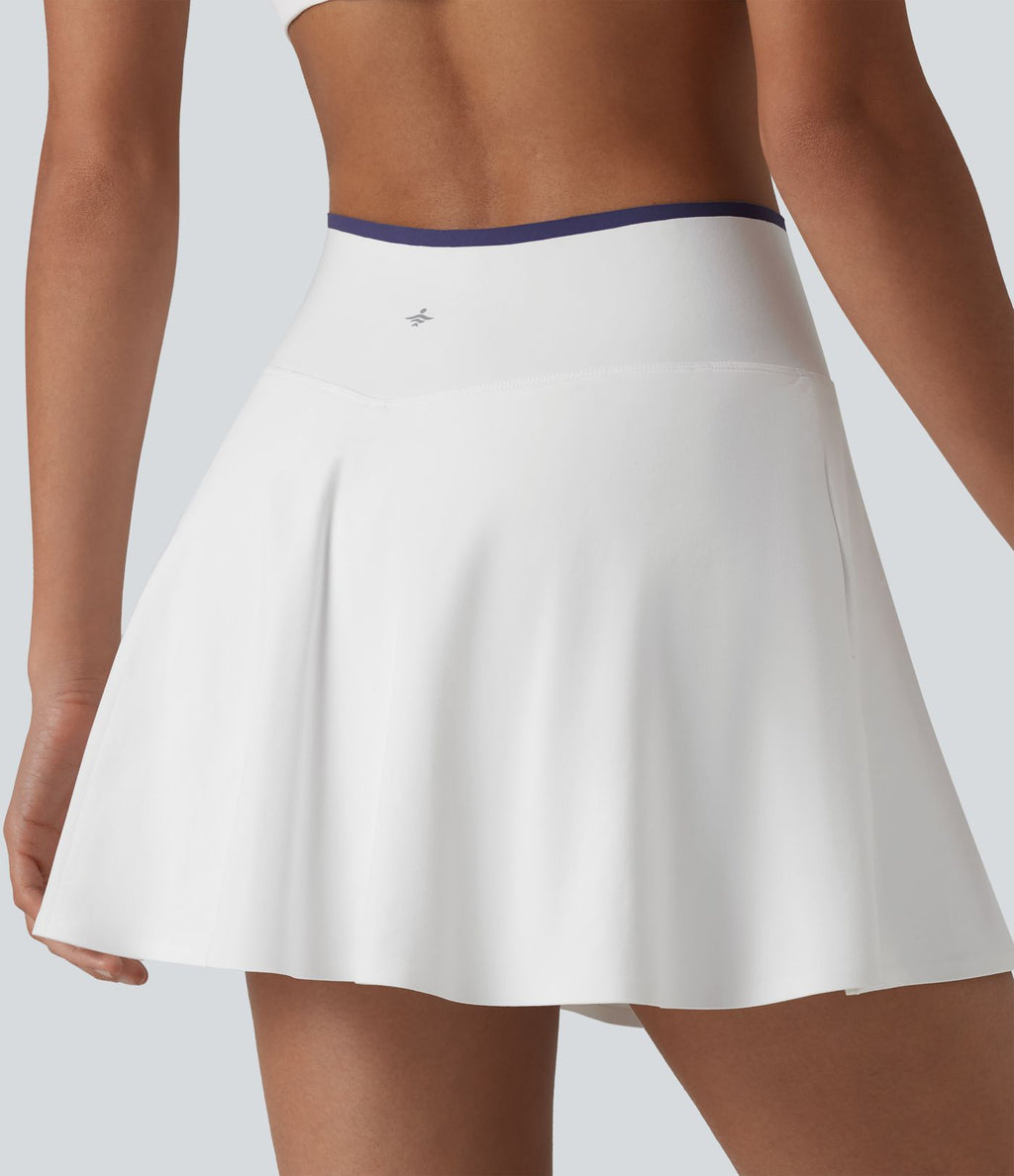 Jupe de tennis mini 2-en-1 color block croisée taille mi-haute avec poches