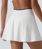 Jupe de tennis mini 2-en-1 color block croisée taille mi-haute avec poches
