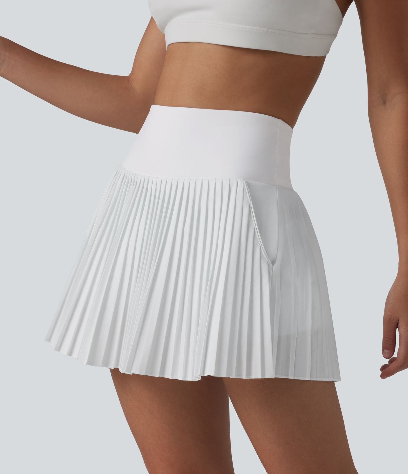 Breezeful™ Jupe mini de tennis plissée 2 en 1 taille haute séchage rapide avec poches