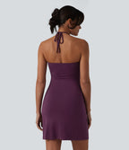 Robe resort mini dos nu à col licou avec lien noué dans le dos et poches