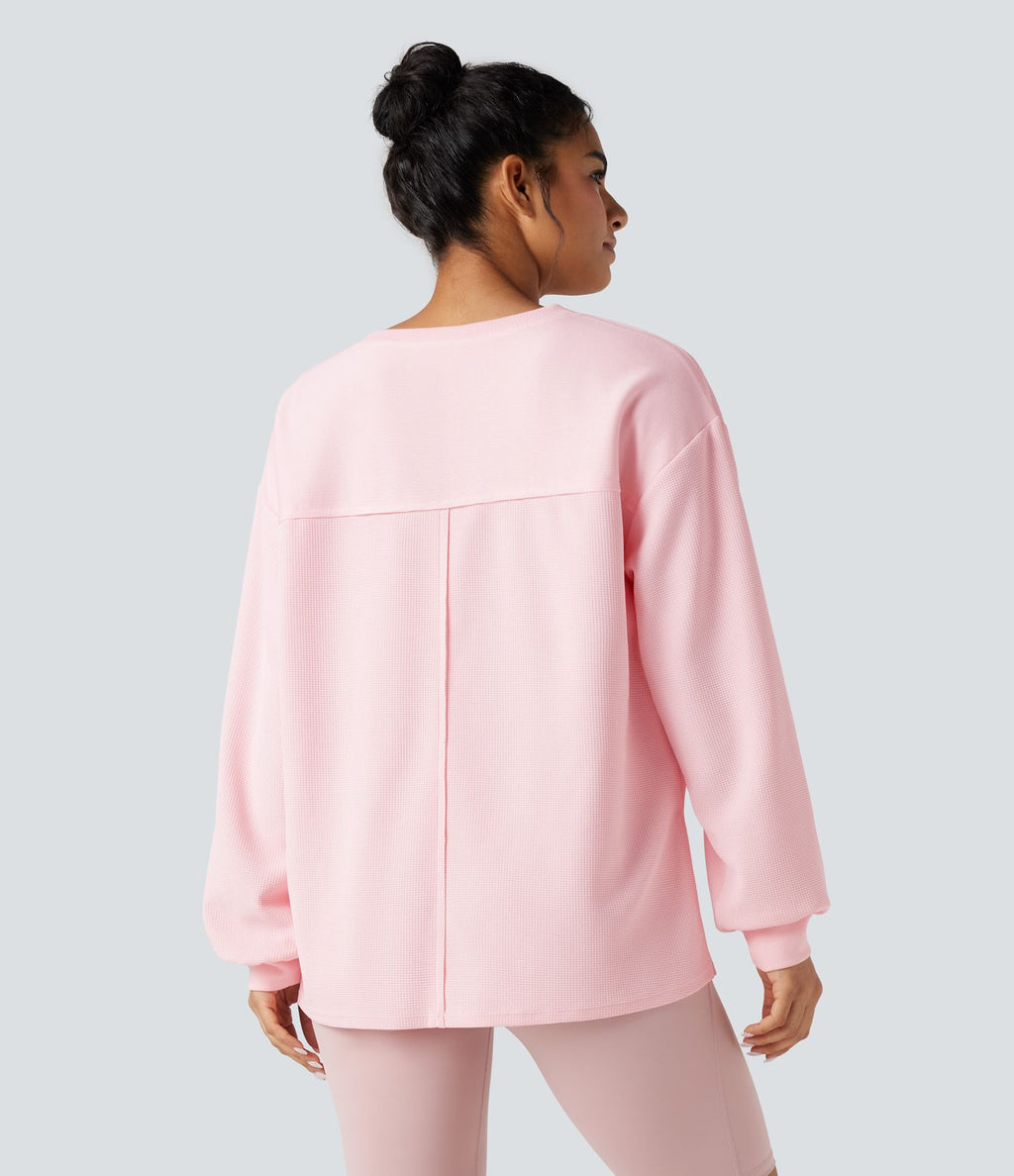 Sweat-shirt gaufré oversize col rond manches longues ourlet fendu avec poches