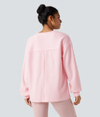 Sweat-shirt gaufré oversize col rond manches longues ourlet fendu avec poches