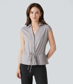 Chemise tailleur sans manches col V avec braguette boutonnée et cordon