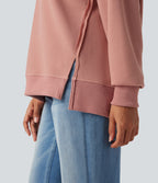 Sweat-shirt gaufré col rond ourlet fendu manches longues