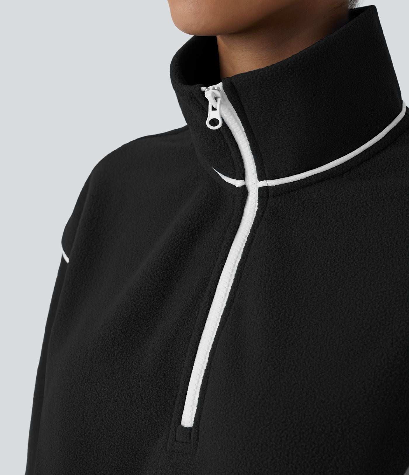 Sweat bicolore en polaire col montant avec demi-zip et manches longues