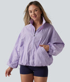 Veste de sport déperlante col montant manches longues zippée avec poches
