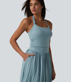 Robe longue fluide dos nu avec tour de cou, brassière intégrée et poches
