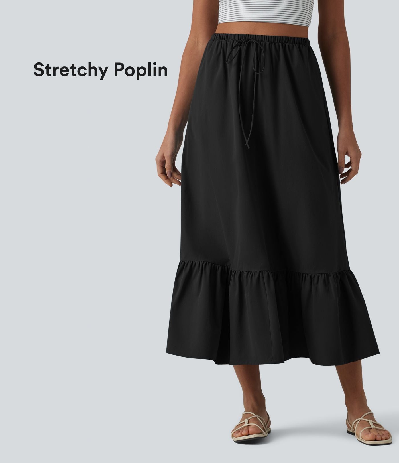 Jupe casual mi-longue évasée en popeline stretch taille haute avec cordon de serrage, ourlet volanté et poches