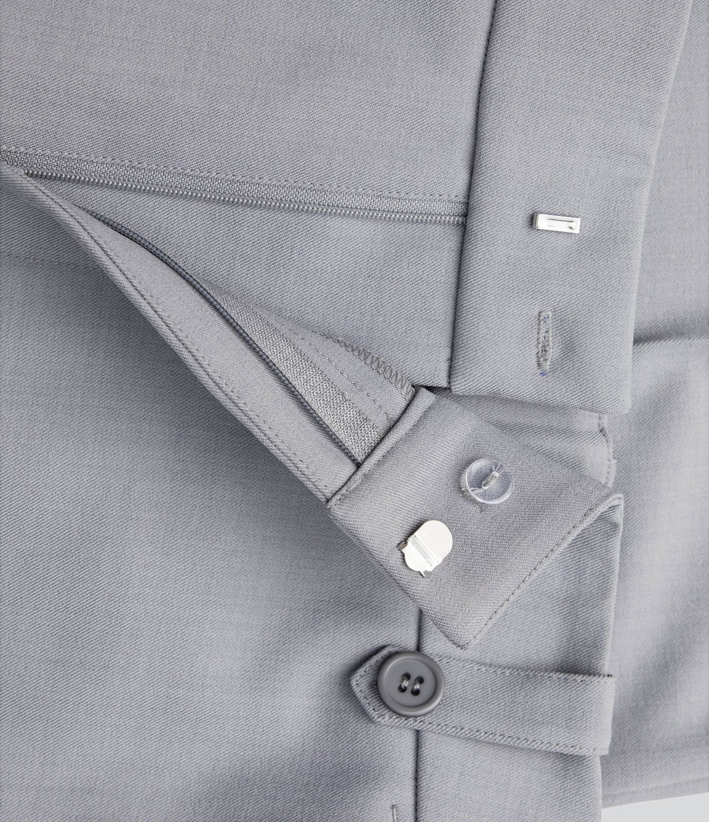 Pantalon de costume taille moyenne longueur cheville jambe droite avec poches latérales