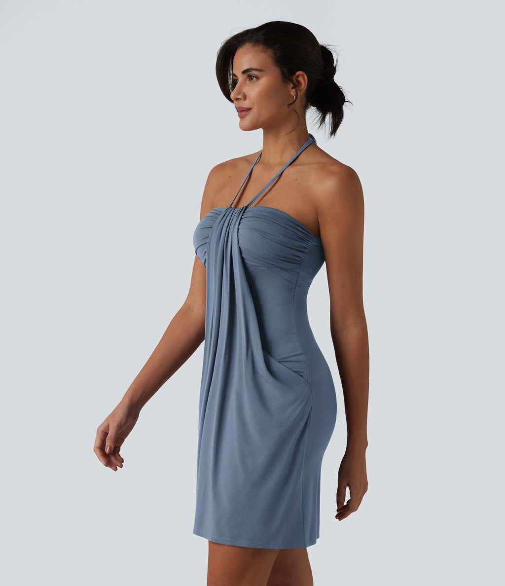Robe resort mini dos nu à col licou avec lien noué dans le dos et poches