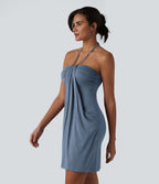 Robe resort mini dos nu à col licou avec lien noué dans le dos et poches