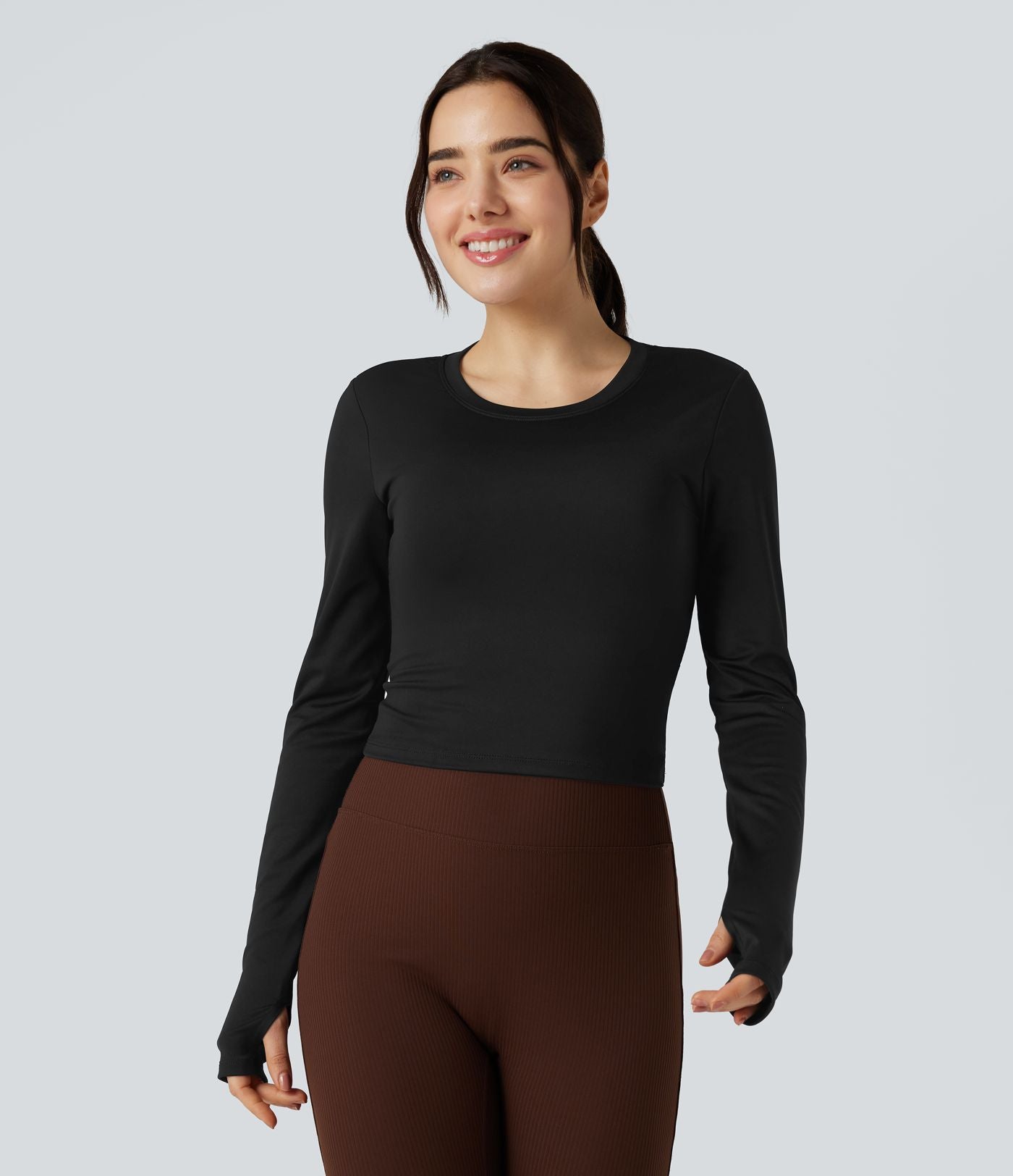Top de sport yoga col rond dos nu torsadé manches longues avec trous pouces