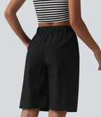 Bermuda ample infroissable taille haute plissé aspect lin avec fermeture éclair invisible et poches