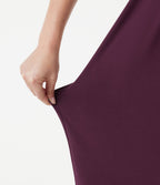 Robe midi dos nu à col halter avec lien noué au dos et poches