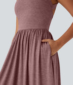 Robe longue fluide fendue avec poches latérales, dos nu et effet torsadé