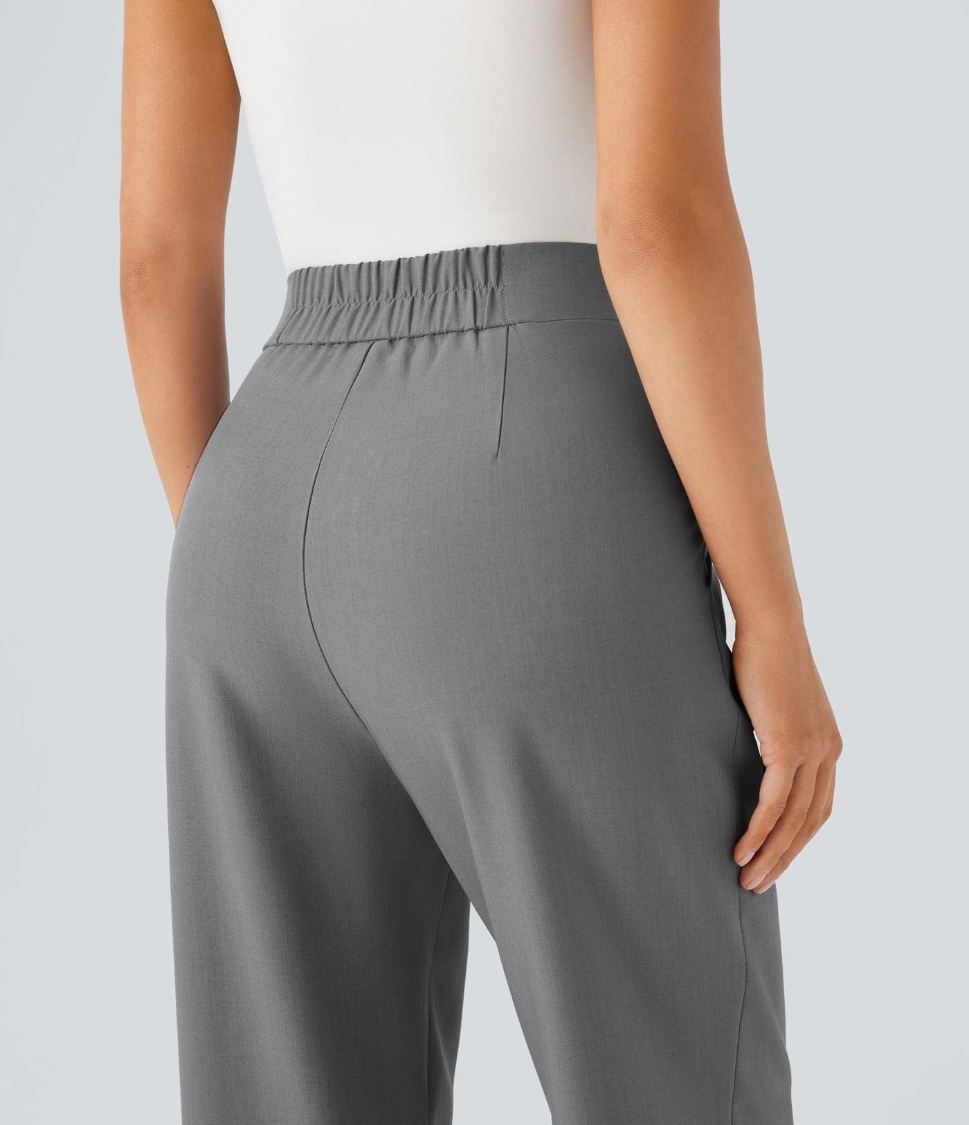 Pantalon tailleur taille haute froncé coupe fuselée avec poches et fermeture éclair invisible sur le côté