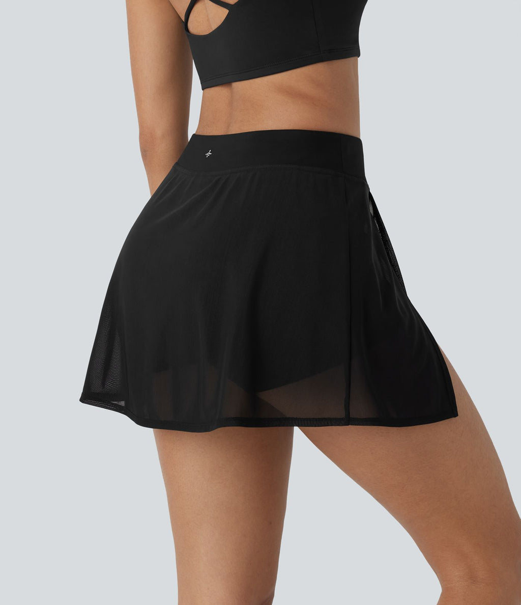Mini-jupe de yoga taille haute avec short intégré, poches latérales et empiècements en maille contrastée avec fentes