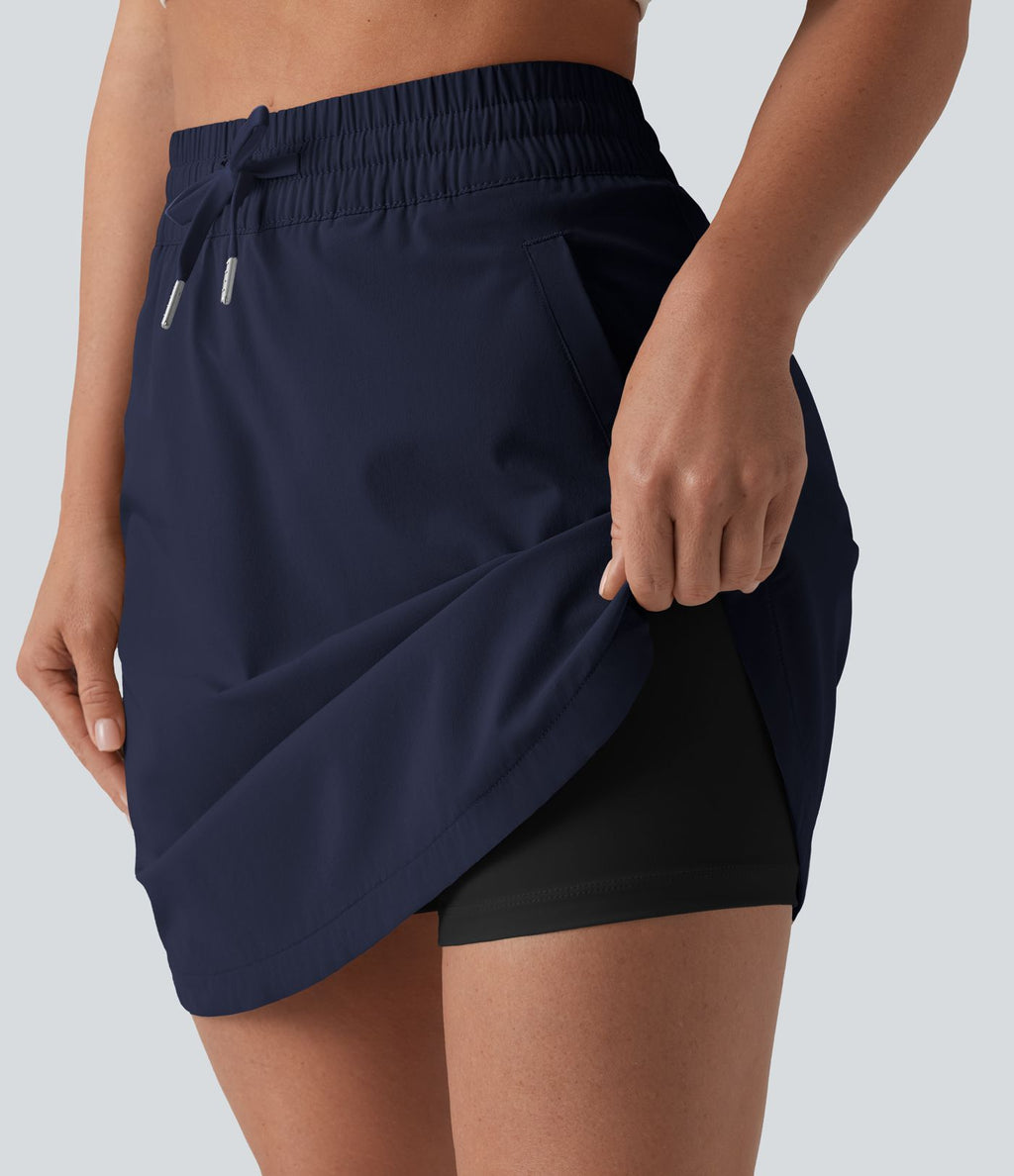 Jupe-short golf mini 2-en-1 taille haute à cordon de serrage et ourlet arrondi avec poches - Longueur plus longue