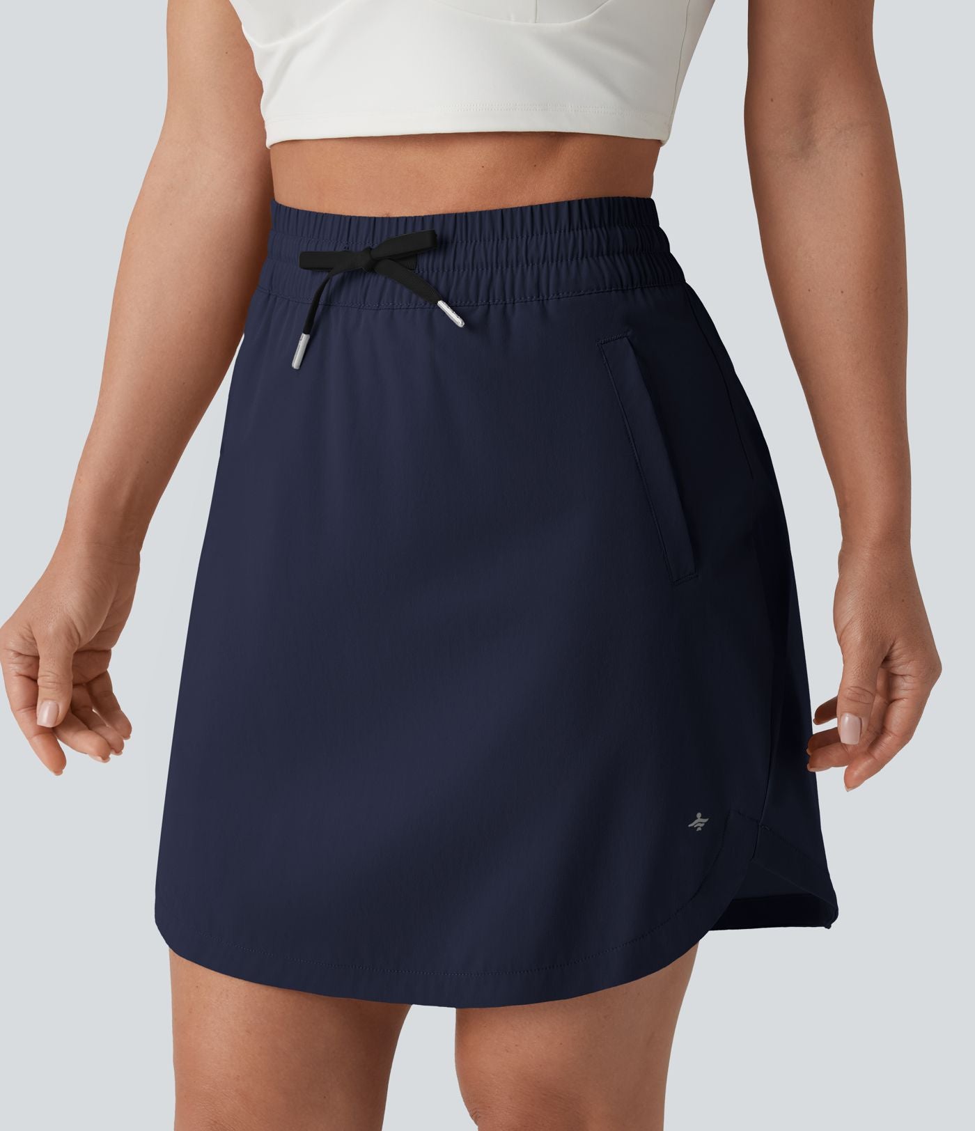 Jupe-short golf mini 2-en-1 taille haute à cordon de serrage et ourlet arrondi avec poches - Longueur plus longue