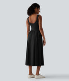 Robe midi fluide sans manches dos croisé ouvert avec poches