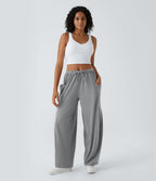 Pantalon Large Fluide Taille Mi-Haute Taille Élastique Cordon Poches Latérales Ourlet Flottant