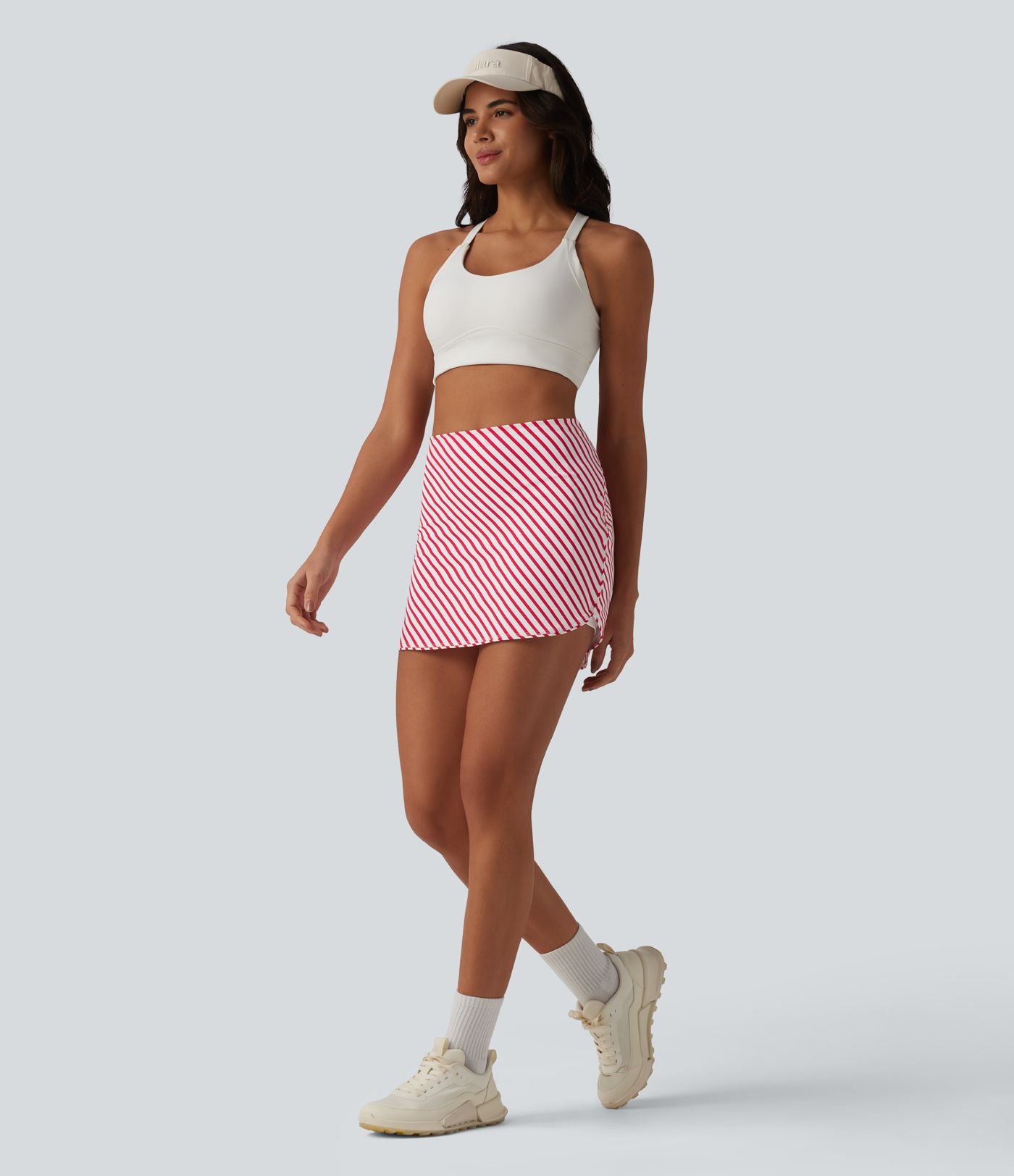 Jupe mini de tennis 2-en-1 à rayures taille haute avec ourlet arrondi et poches