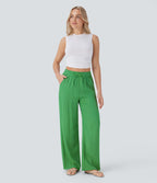 Pantalon large fluide taille haute avec cordon de serrage, poches latérales et aspect lin