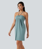 Robe resort mini dos nu à col licou avec lien noué dans le dos et poches