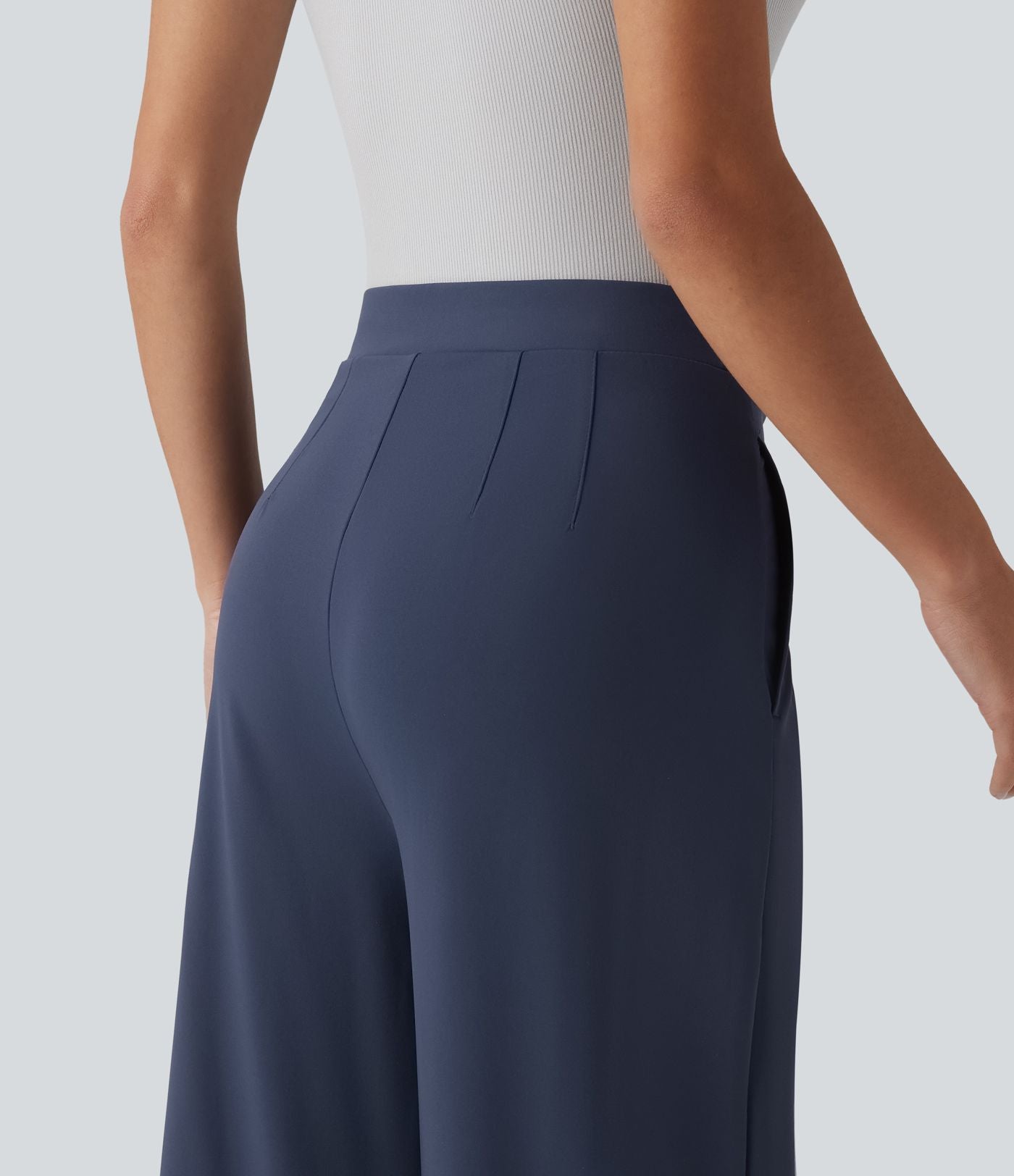 Pantalon tailleur évasé asymétrique taille mi-haute avec poches