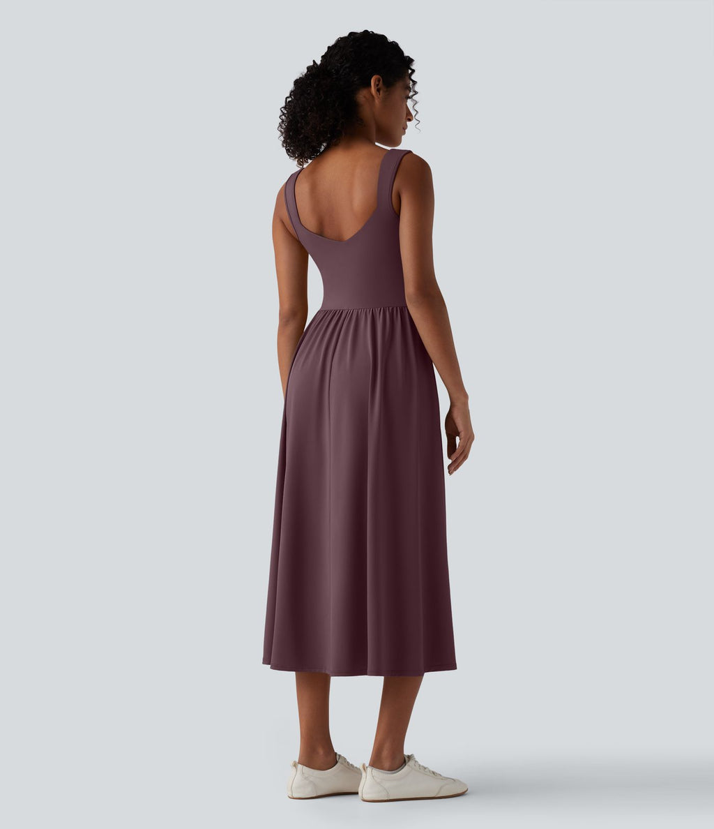 Robe midi fluide sans manches dos croisé ouvert avec poches