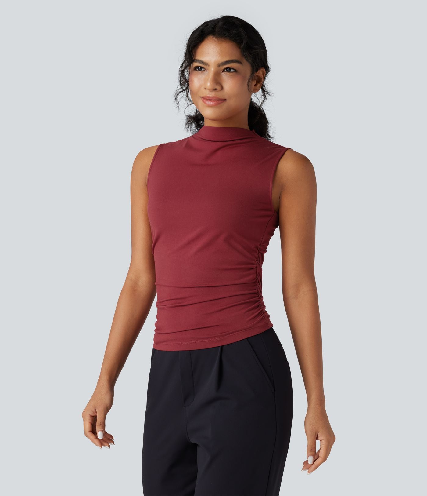 Top tailleur froncé col montant sans manches