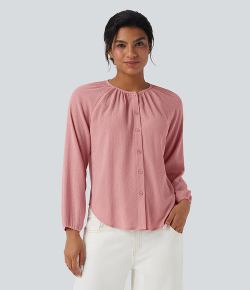 Blouse texturée col rond manches longues ourlet arrondi