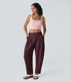 Pantalon tailleur ample, taille moyenne, coupe barrel, à poches