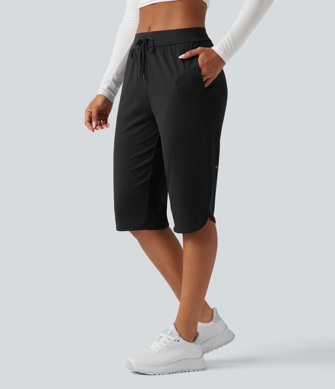 Pantacourt de golf taille mi-haute à séchage rapide avec cordon de serrage, ourlet arrondi, poches et protection solaire UPF40+