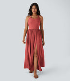 Robe longue fluide fendue avec poches latérales, dos nu et effet torsadé
