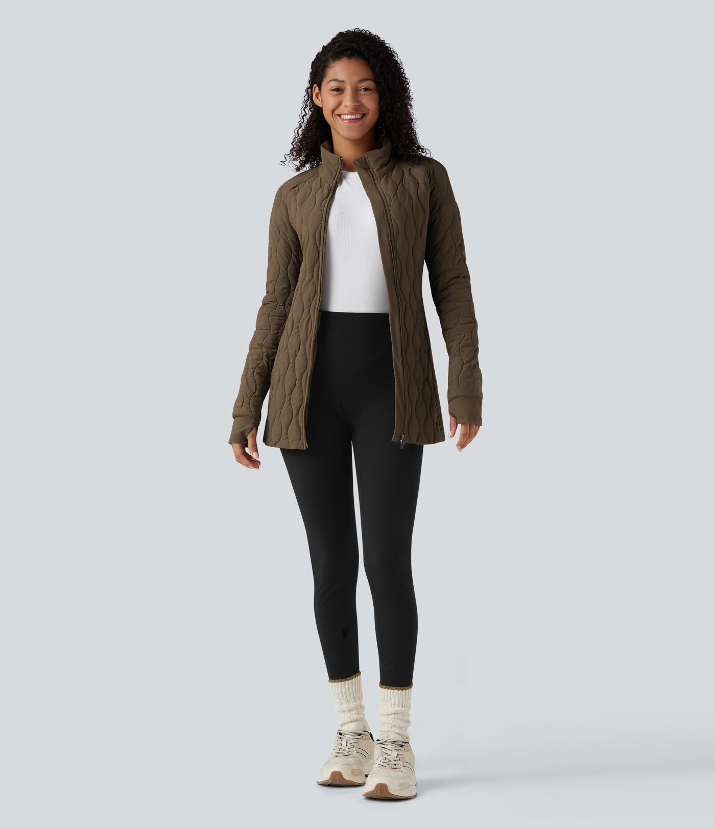 Veste matelassée de sport PuffFlex à col montant, manches longues, fermeture éclair avec passe-pouces et poches