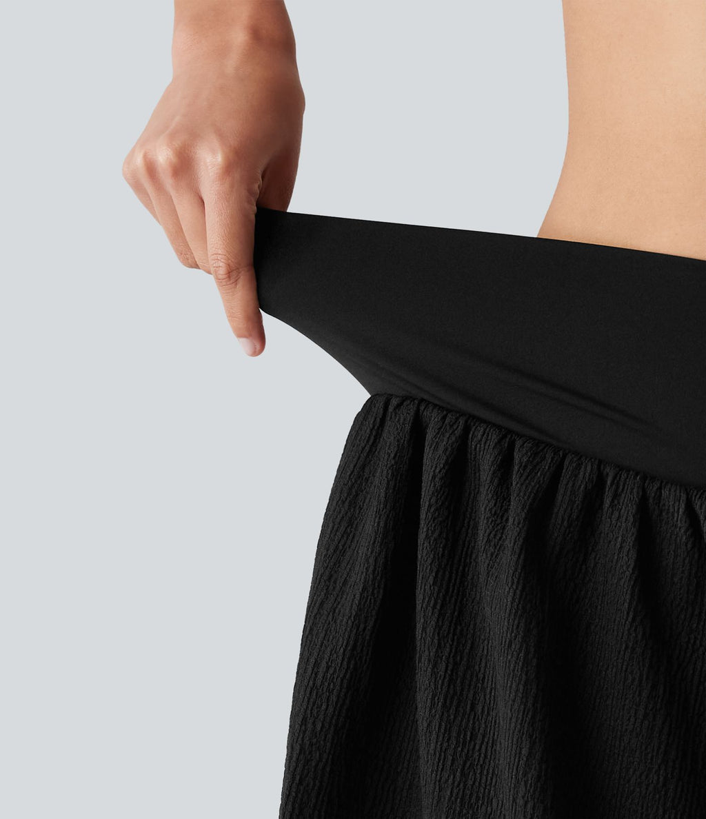 Short de running 2-en-1 taille haute croisée en tissu froissé avec ourlet fendu et poches