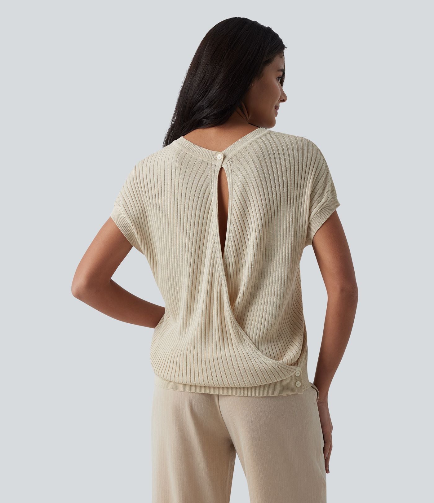 Pull casual col rond manches chauve-souris croisé dos nu