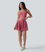 Jupe mini fluide évasée 2-en-1 taille haute à cordon, empiècements en mesh contrastant, avec poche, version plus longue