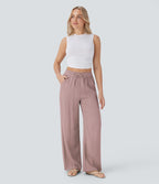Pantalon large fluide taille haute avec cordon de serrage, poches latérales et aspect lin