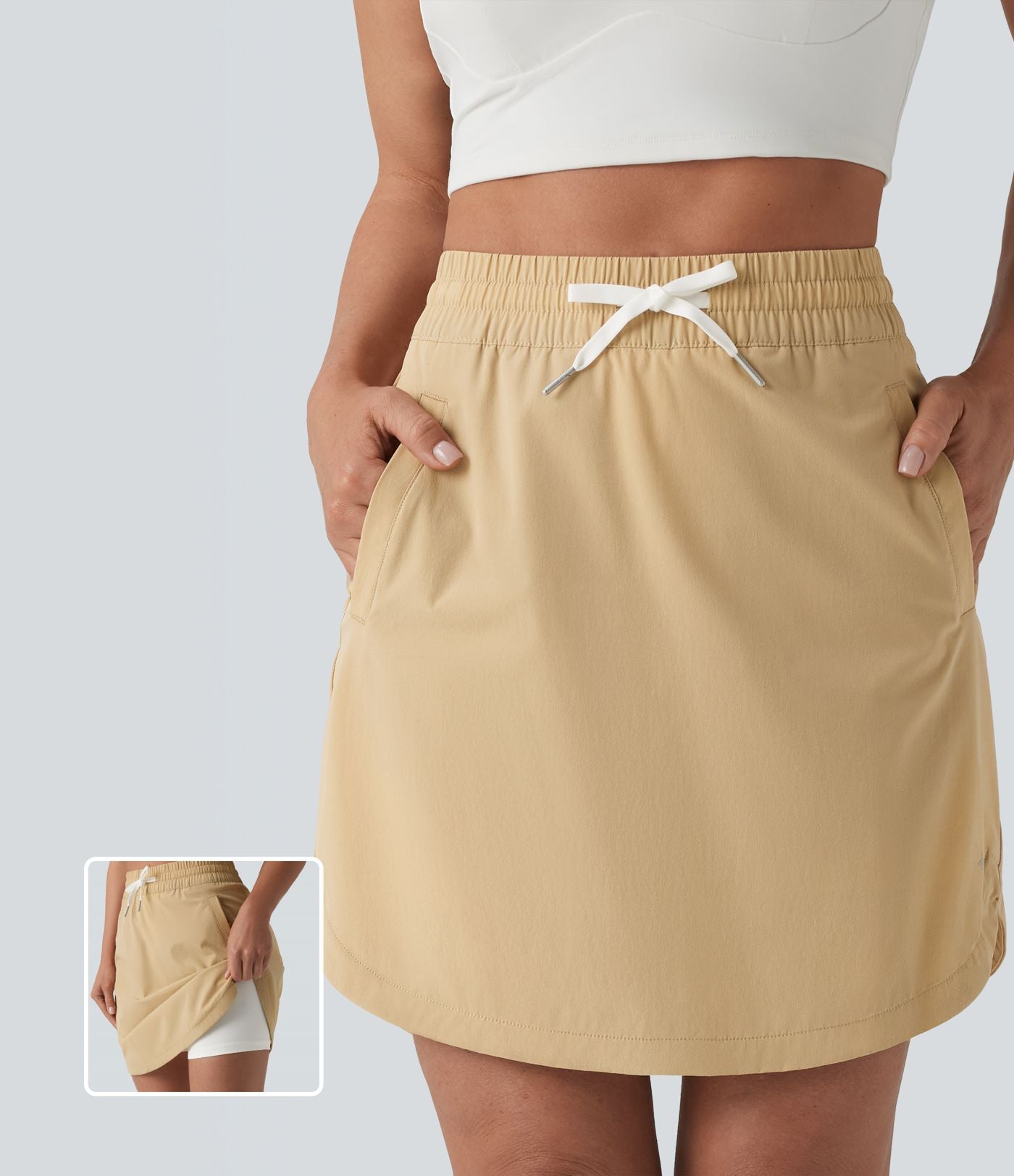 Jupe-short golf mini 2-en-1 taille haute à cordon de serrage et ourlet arrondi avec poches - Longueur plus longue