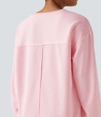 Sweat-shirt gaufré oversize col rond manches longues ourlet fendu avec poches