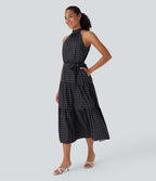 Robe mi-longue fluide de vacances à pois avec col licou, découpe dos, ceinture et poches latérales