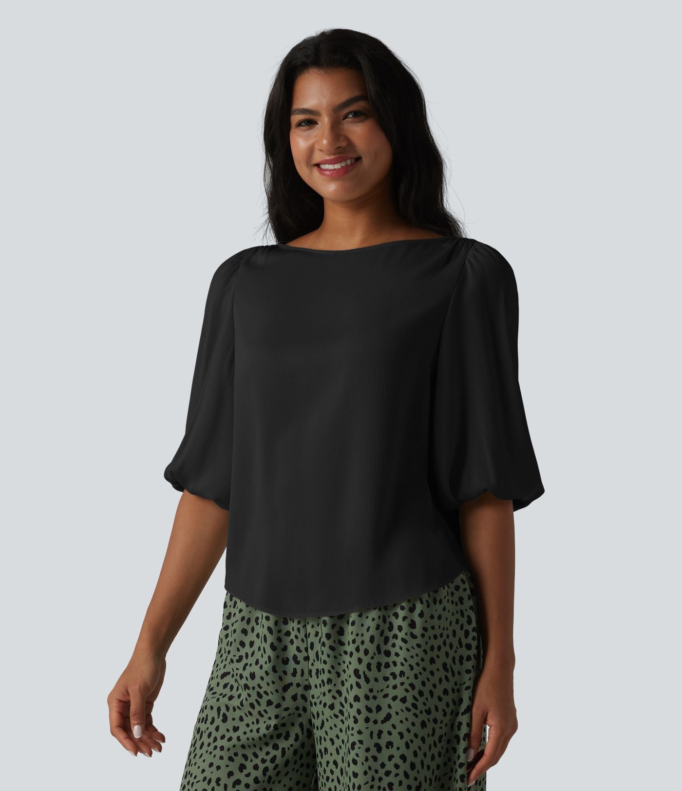 Blouse décontractée à manches bouffantes et ourlet arrondi texturé