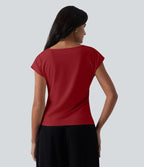 Blouse tailleur asymétrique col drapé manches courtes avec fronces et ourlet fendu