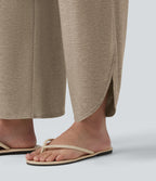 Pantalon décontracté taille haute gainant avec ourlet arrondi et poches