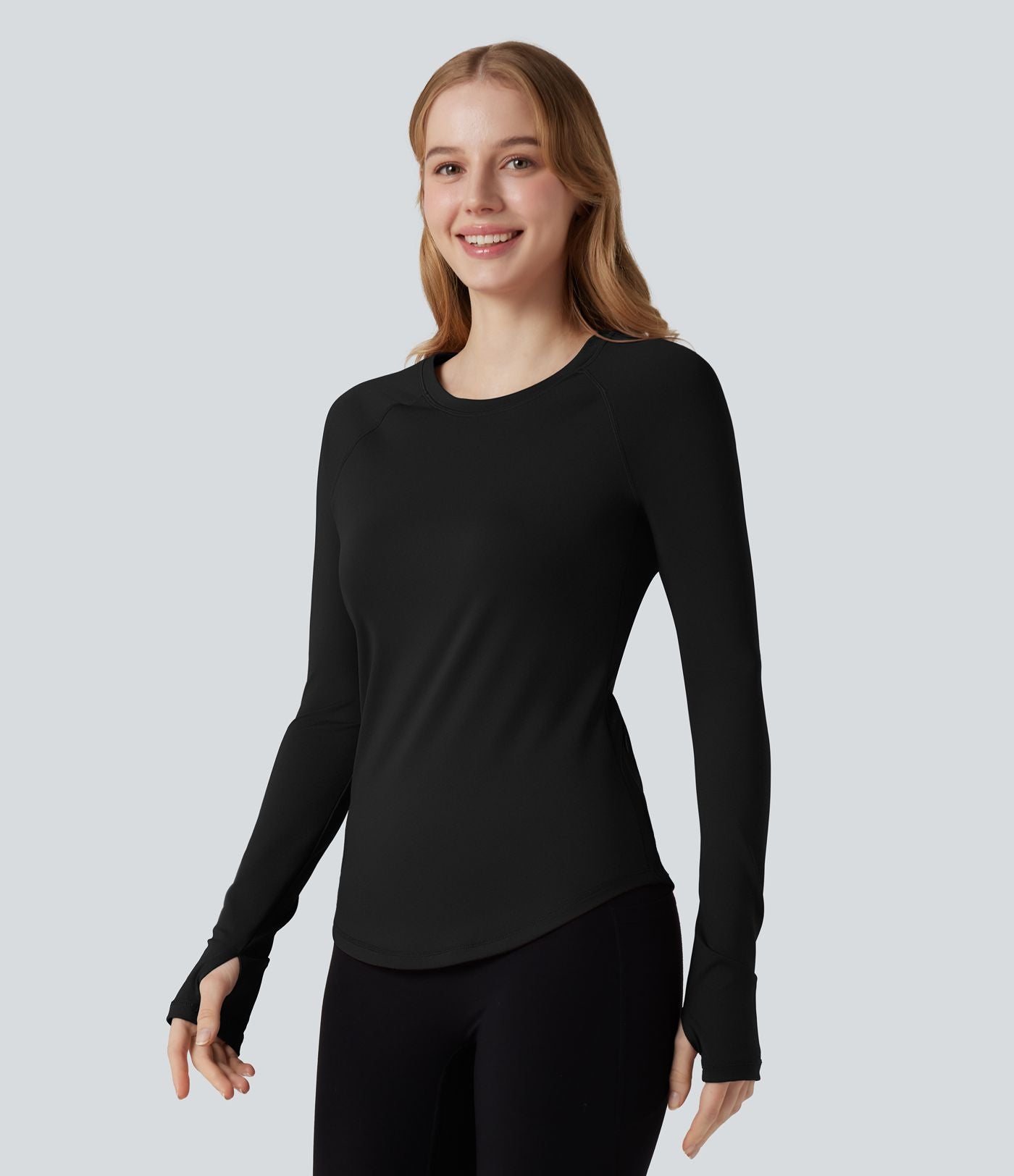 Top de sport col rond ourlet arrondi manches longues avec trous pouces et poche