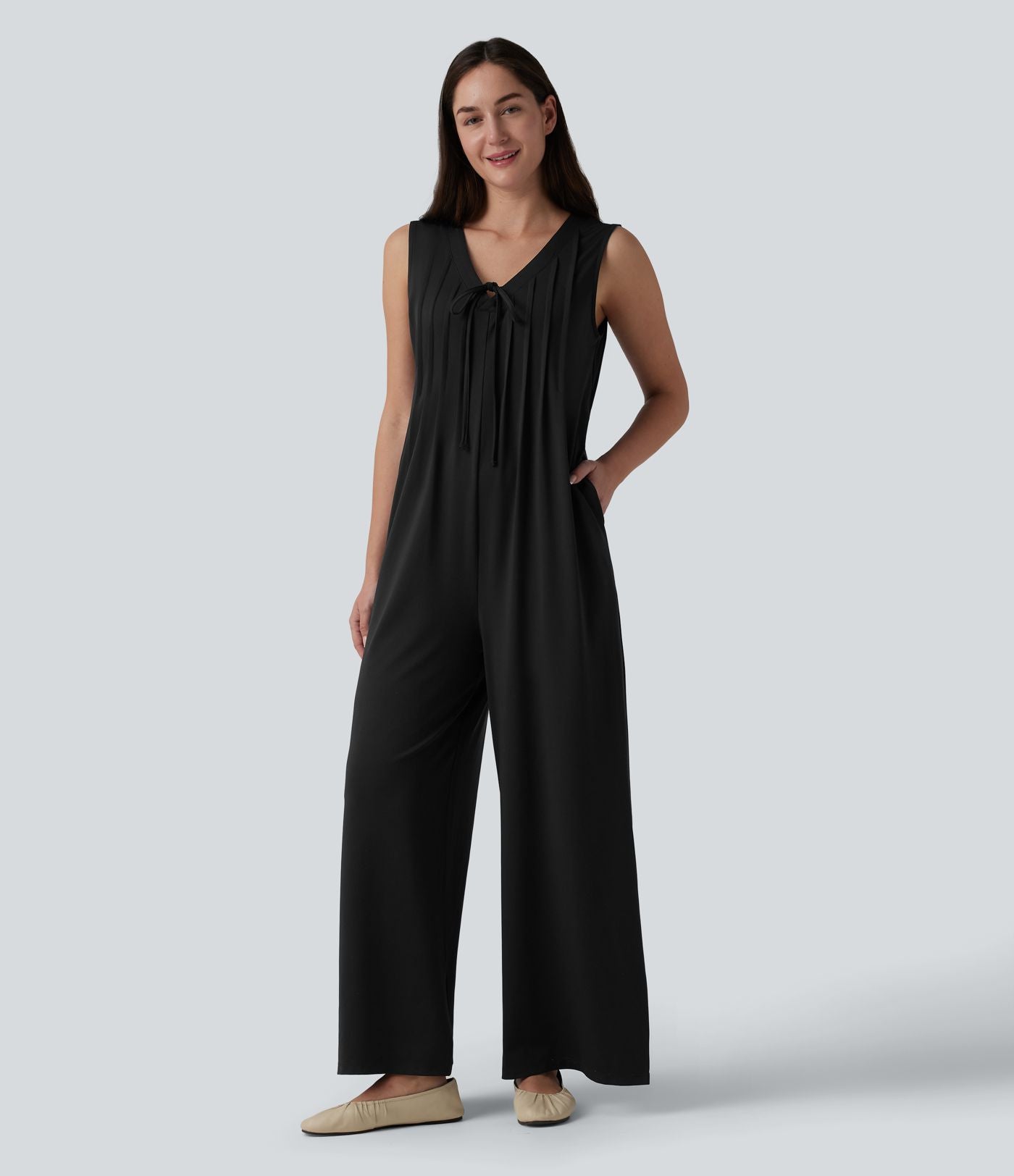 Combinaison casual ample décolleté plongeant sans manches plissée à nœud devant et fermeture éclair invisible avec poches
