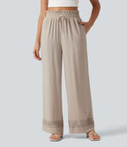 Pantalon effet lin taille haute avec cordon de serrage, bord volanté et poches