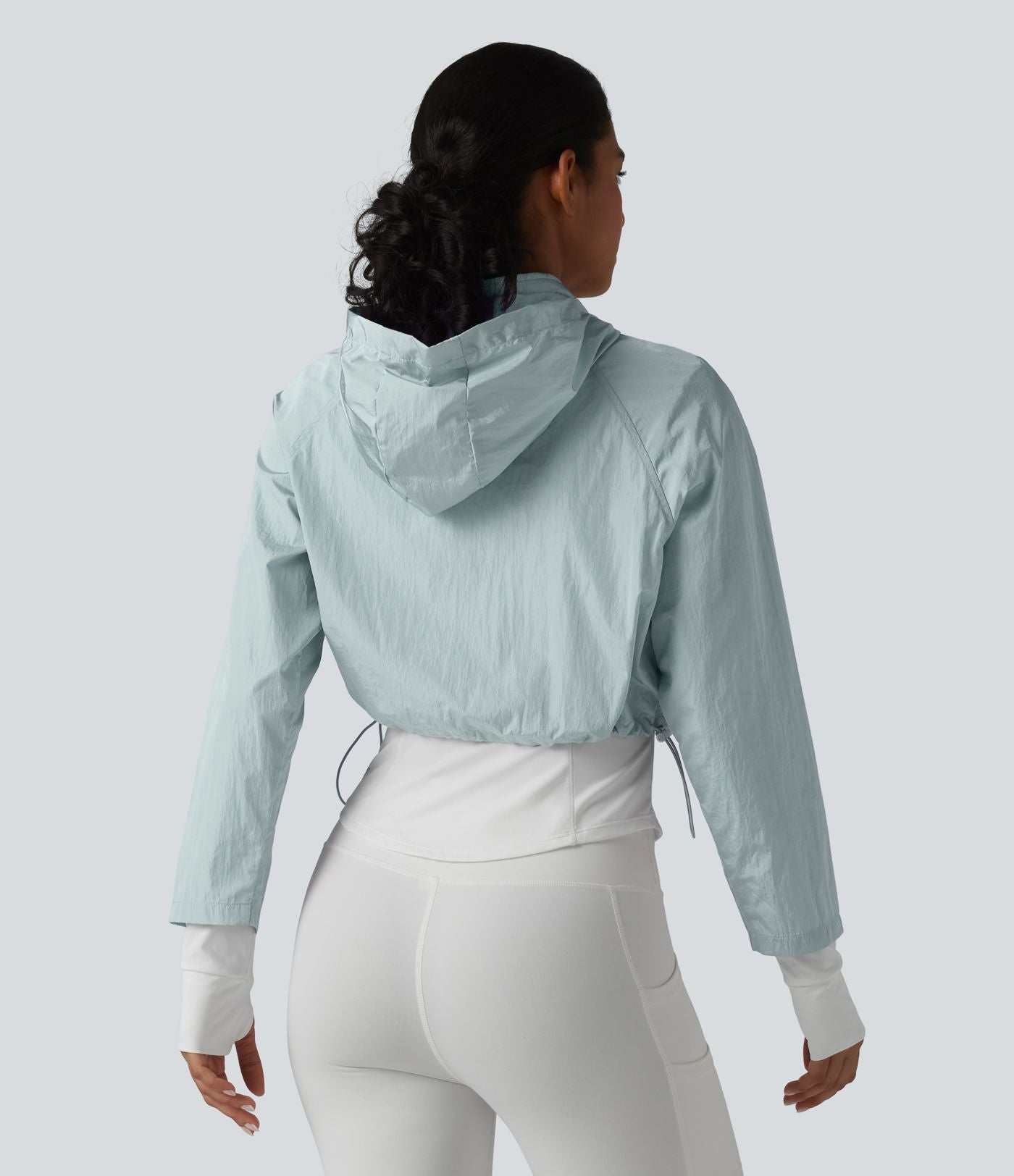 Veste de running 3-en-1 déperlante à capuche avec trous pour les pouces, ourlet arrondi et poches